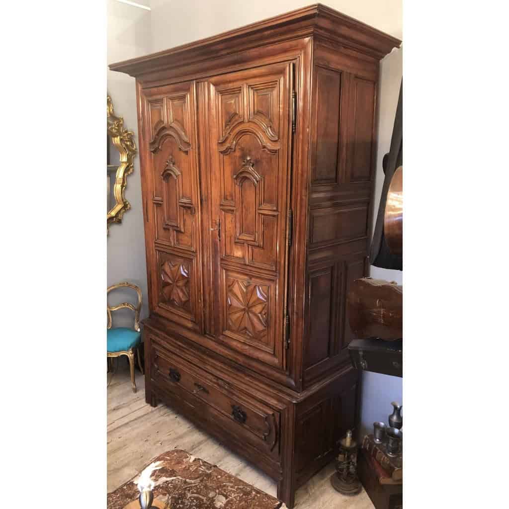 17th century cherry wood trouser cabinet with two doors and a large drawer. | Biron 17th century cherry wood trouser cabinet with two doors and a large drawer.
