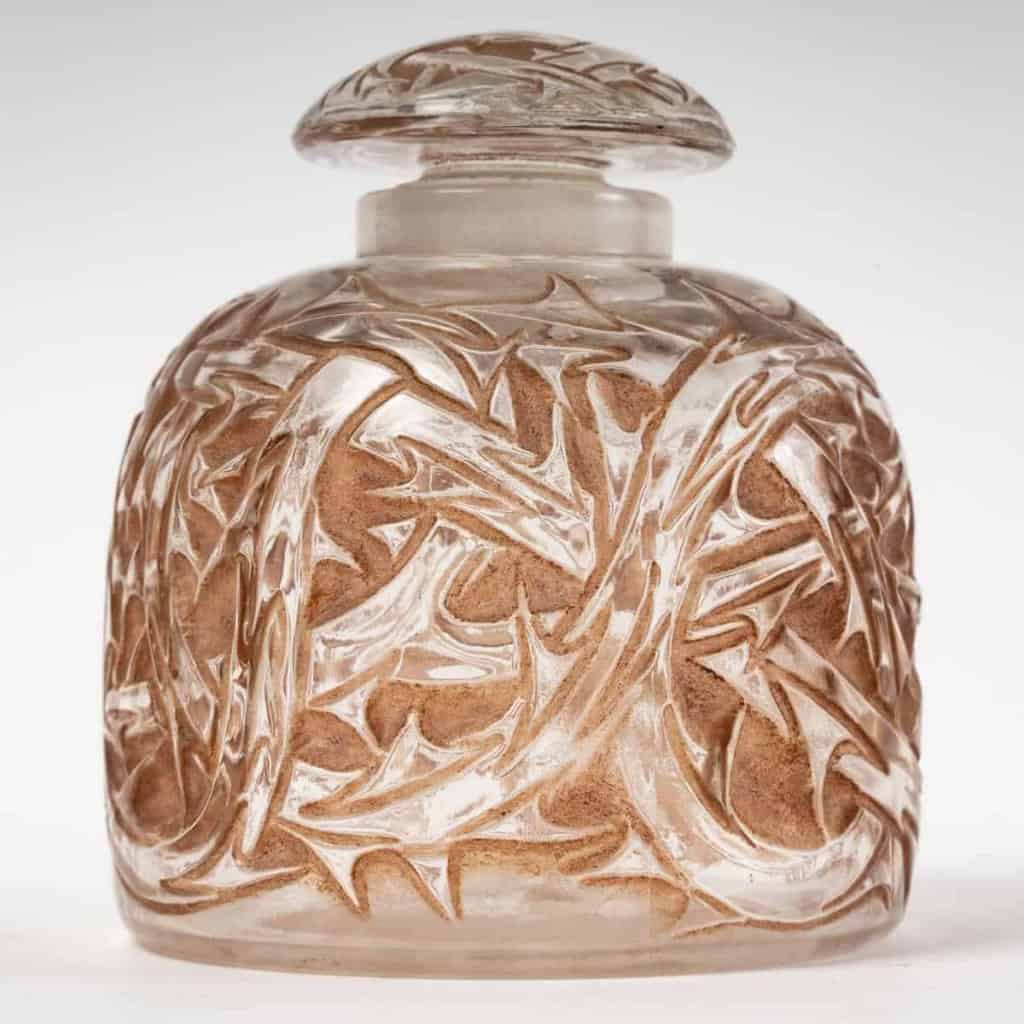 Partie de Garniture de Toilette « Epines » verre blanc patiné sépia de René LALIQUE – 4 pièces | Biron Partie de Garniture de Toilette "Epines" verre blanc patiné sépia de René LALIQUE - 4 pièces