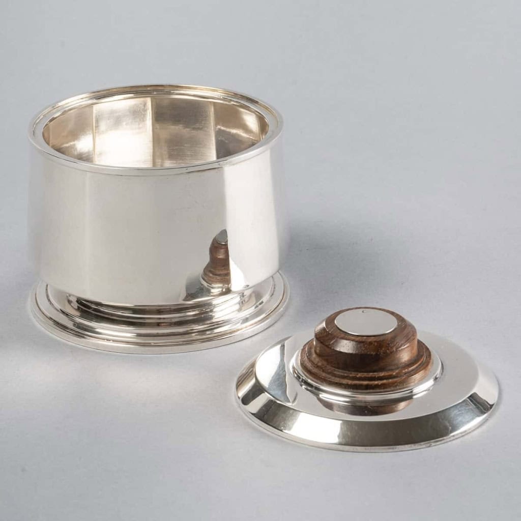 Service Thé et Café Pans Coupés en argent massif et prises en palissandre de Jean E. Puiforcat | Biron Service Thé et Café Pans Coupés en argent massif et prises en palissandre de Jean E. Puiforcat