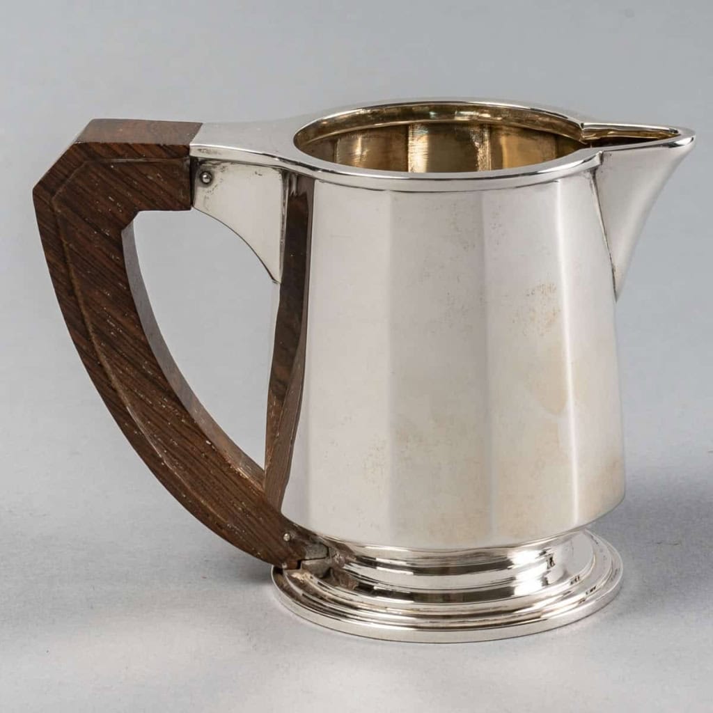 Service Thé et Café Pans Coupés en argent massif et prises en palissandre de Jean E. Puiforcat | Biron Service Thé et Café Pans Coupés en argent massif et prises en palissandre de Jean E. Puiforcat
