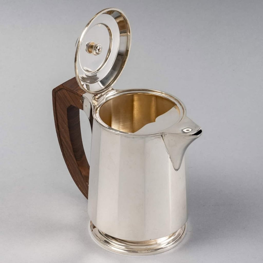 Service Thé et Café Pans Coupés en argent massif et prises en palissandre de Jean E. Puiforcat | Biron Service Thé et Café Pans Coupés en argent massif et prises en palissandre de Jean E. Puiforcat