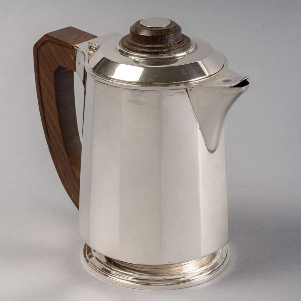Service Thé et Café Pans Coupés en argent massif et prises en palissandre de Jean E. Puiforcat | Biron Service Thé et Café Pans Coupés en argent massif et prises en palissandre de Jean E. Puiforcat