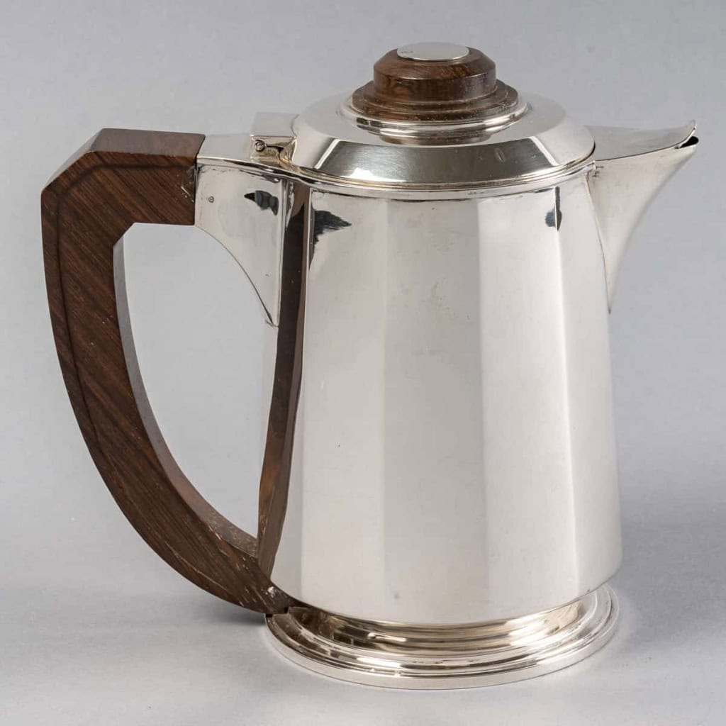 Service Thé et Café Pans Coupés en argent massif et prises en palissandre de Jean E. Puiforcat | Biron Service Thé et Café Pans Coupés en argent massif et prises en palissandre de Jean E. Puiforcat