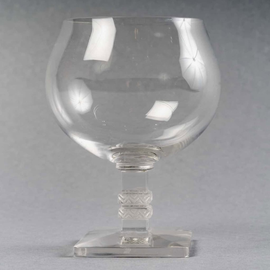 Suite de Verres à Cognac « Argos » verre blanc de René LALIQUE – 5 pièces | Biron Suite de Verres à Cognac "Argos" verre blanc de René LALIQUE - 5 pièces