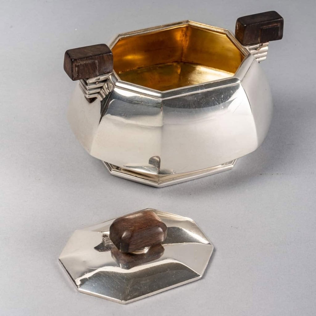 Service Thé et Café Pans Coupés argent massif prises en palissandre de Jean E. PUIFORCAT | Biron Service Thé et Café Pans Coupés argent massif prises en palissandre de Jean E. PUIFORCAT