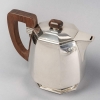 Service Thé et Café Pans Coupés argent massif prises en palissandre de Jean E. PUIFORCAT | Biron Service Thé et Café Pans Coupés argent massif prises en palissandre de Jean E. PUIFORCAT