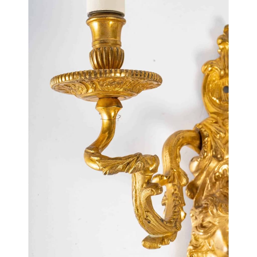 Suite de quatre appliques de style Régence. | Biron Suite de quatre appliques de style Régence.