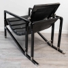 Transat cuir noir et bois laqué noir d'Eileen GRAY par Ecart International