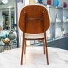 Ensemble de 6 chaises danoises en teck recouvertes de tissu en mouton bouclé.