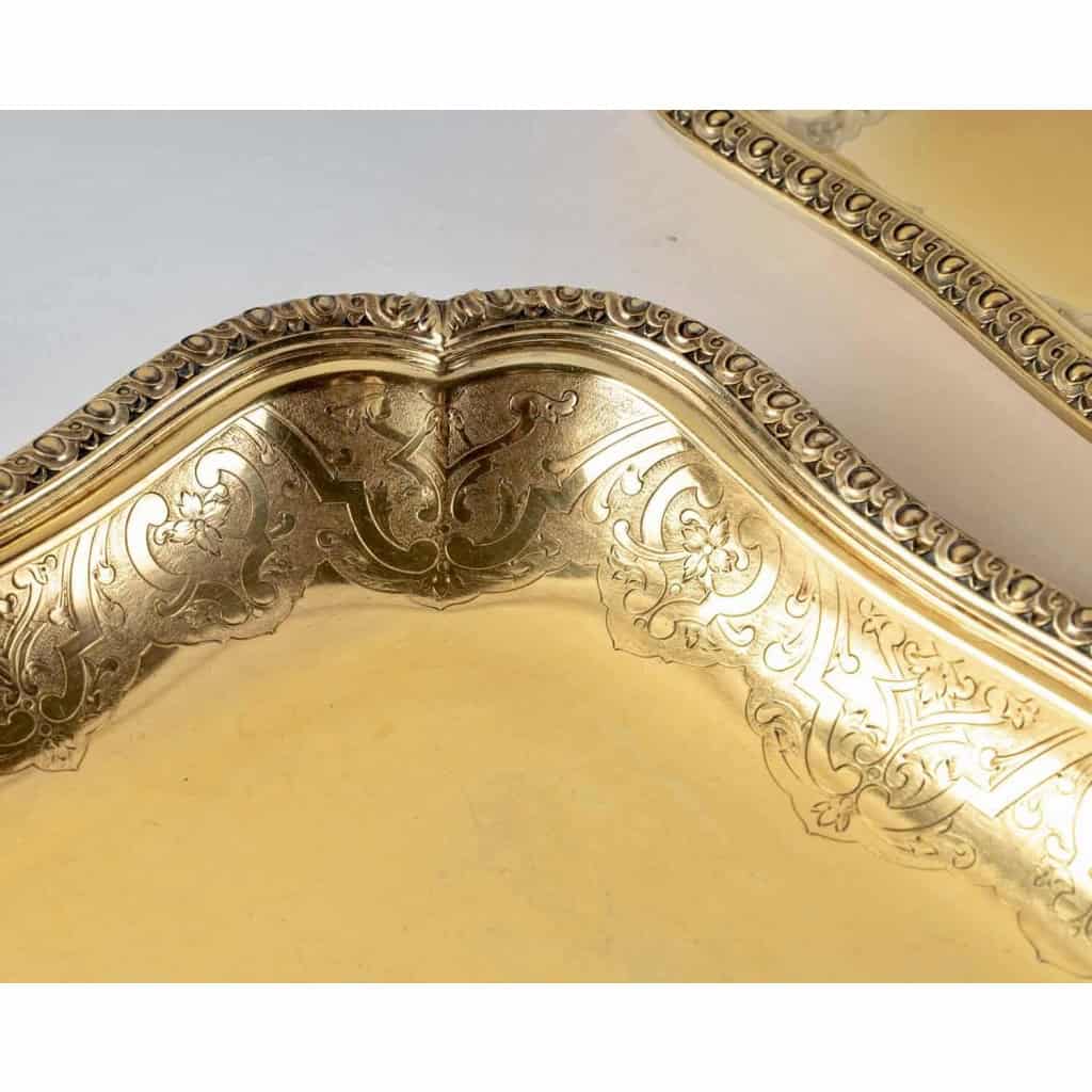 Suite de 7 plats de service "Elysée" en vermeil (argent massif plaqué or) de PUIFORCAT