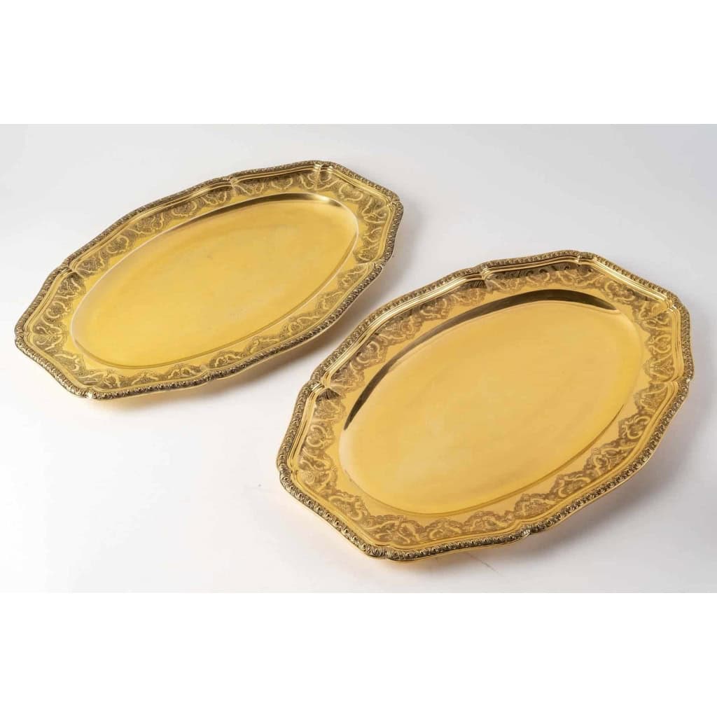 Suite de 7 plats de service "Elysée" en vermeil (argent massif plaqué or) de PUIFORCAT