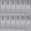 Suite de 12 Flûtes à Champagne « Ange de Reims » cristal blanc de LALIQUE FRANCE | Biron Suite de 12 Flûtes à Champagne "Ange de Reims" cristal blanc de LALIQUE FRANCE