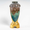 Vase en grès flammé à décor de coulures, sur socle en bronze à patine dorée, signé Paul Louchet, début XXe siècle. | Biron |||||||||||||
