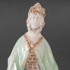 Statuette en porcelaine à couverte émaillée blanc et turquoise, intitulée « Princesse Irène », signée Mougin, Nancy, début du XXe siècle. | Biron Statuette en porcelaine à couverte émaillée blanc et turquoise, intitulée "Princesse Irène", signée Mougin, Nancy, début du XXe siècle.