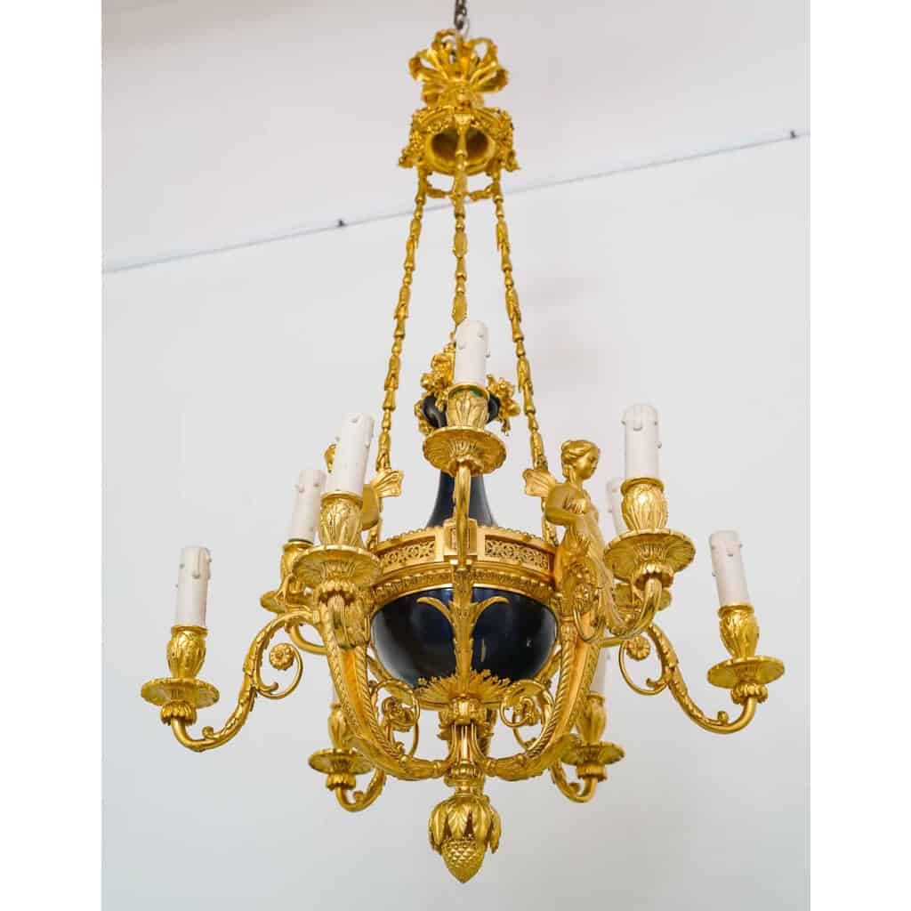 Lustre en bronze doré et métal patiné dit « aux Termes » fin XIXème Siècle | Biron Lustre en bronze doré et métal patiné dit "aux Termes" fin XIXème Siècle