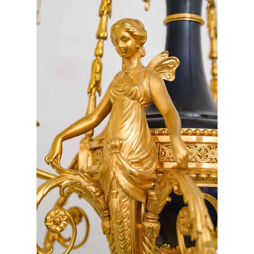 Lustre en bronze doré et métal patiné dit « aux Termes » fin XIXème Siècle | Biron Lustre en bronze doré et métal patiné dit "aux Termes" fin XIXème Siècle