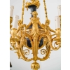Lustre en bronze doré et métal patiné dit « aux Termes » fin XIXème Siècle | Biron Lustre en bronze doré et métal patiné dit "aux Termes" fin XIXème Siècle