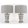 Paire de Lampes « Pan » cristal blanc patiné gris de Marc LALIQUE | Biron Paire de Lampes "Pan" cristal blanc patiné gris de Marc LALIQUE
