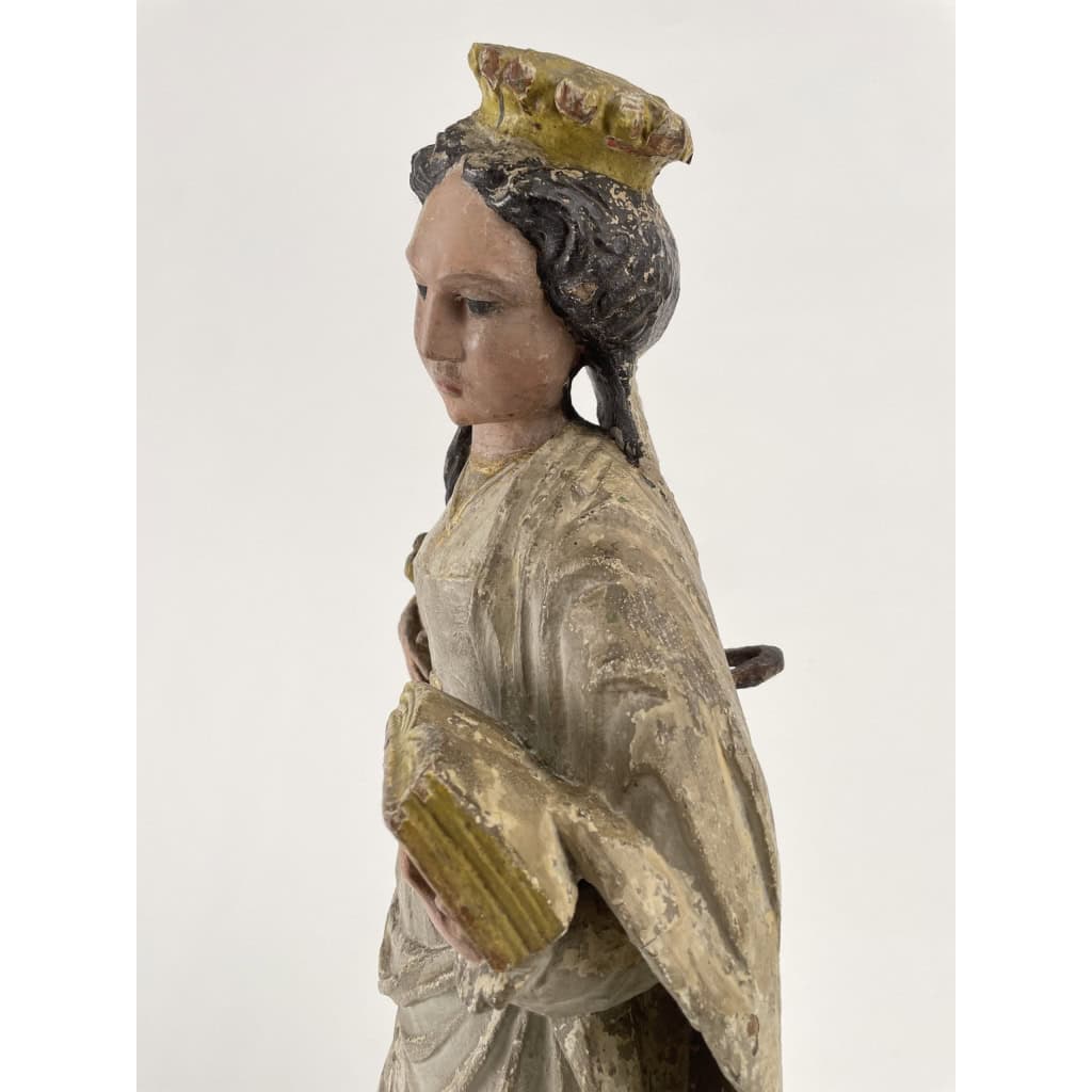 Sainte Catherine d’Alexandrie, Sculpture polychrome et dorée. France milieu XVIe siècle. | Biron Sainte Catherine d’Alexandrie, Sculpture polychrome et dorée. France milieu XVIe siècle.