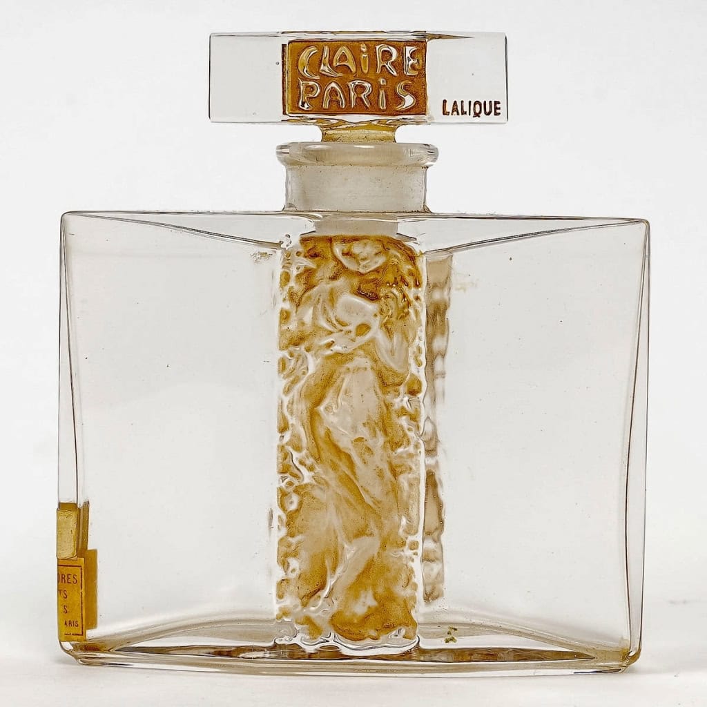 Flacon « L’Orée » verre blanc patiné sépia de René LALIQUE pour Claire Paris | Biron |||||||||