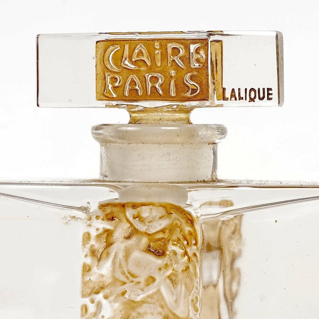 Flacon « L’Orée » verre blanc patiné sépia de René LALIQUE pour Claire Paris | Biron Flacon "L'Orée" verre blanc patiné sépia de René LALIQUE pour Claire Paris