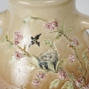 Vase en barbotine à décor en pâte sur pâte de putti et fleurs, signé Carrier-Belleuse pour la faïencerie de Choisy Le Roi, circa 1890 | Biron Vase en barbotine à décor en pâte sur pâte de putti et fleurs, signé Carrier-Belleuse pour la faïencerie de Choisy Le Roi, circa 1890