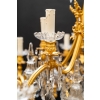 Important lustre en bronze doré et cristaux