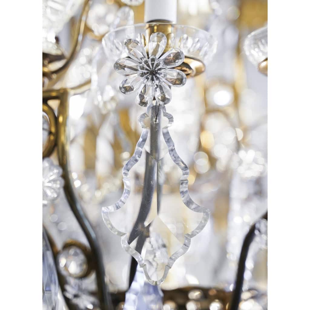 Lustre en bronze et cristal à 12 bras de Lumière | Biron Lustre en bronze et cristal à 12 bras de Lumière