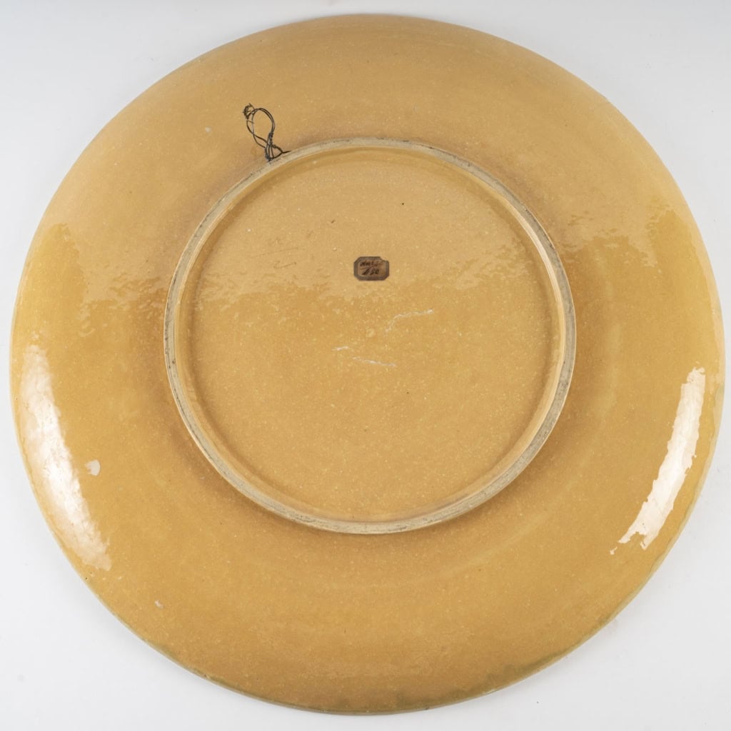Glazed ceramic dish with polychrome decoration representing a mallard duck Produced by the Sèvres factory, signed Emile Richard, Art Nouveau period, circa 1900. | Biron Glazed ceramic dish with polychrome decoration representing a mallard duck Produced by the Sèvres factory, signed Emile Richard, Art Nouveau period, circa 1900.