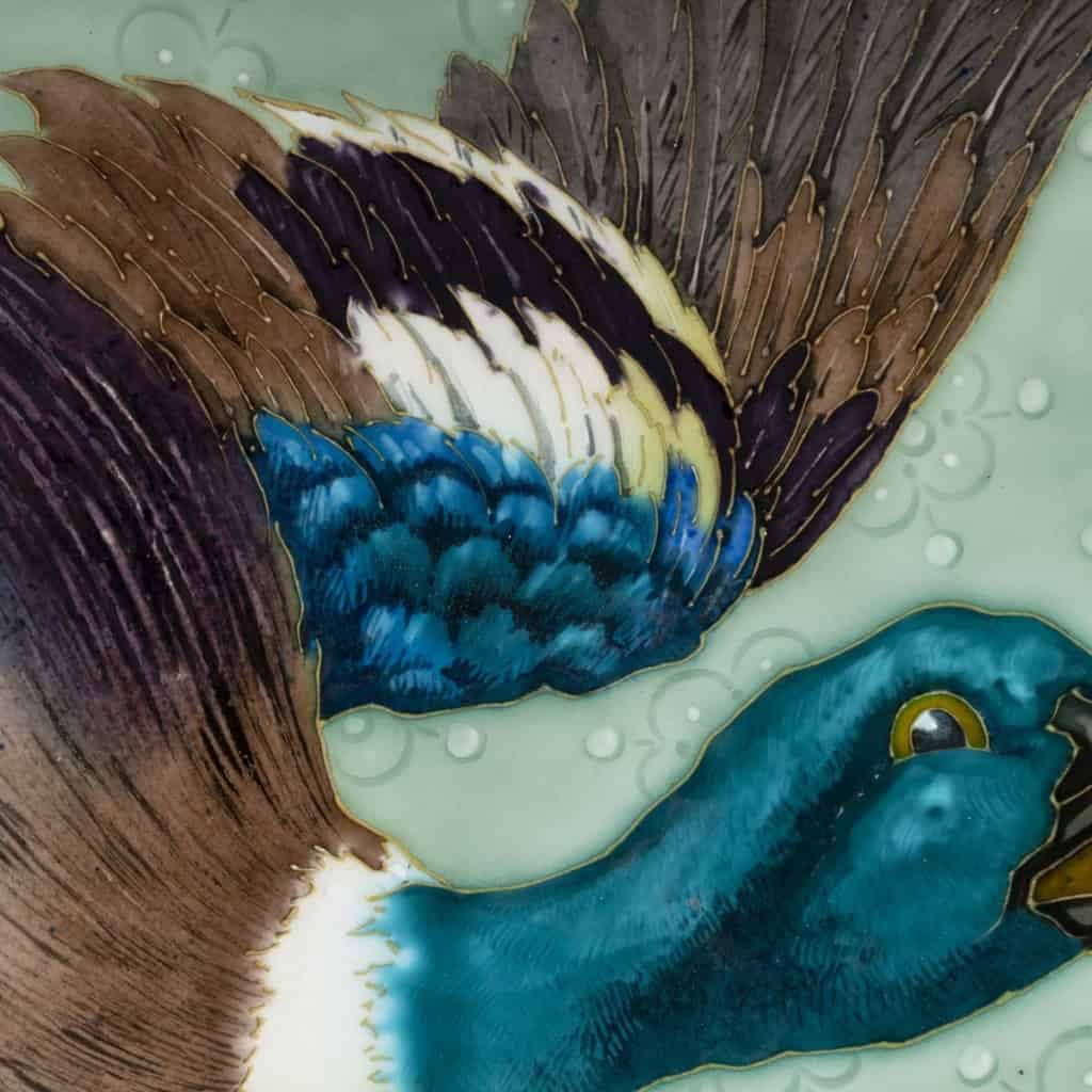 Glazed ceramic dish with polychrome decoration representing a mallard duck Produced by the Sèvres factory, signed Emile Richard, Art Nouveau period, circa 1900. | Biron Glazed ceramic dish with polychrome decoration representing a mallard duck Produced by the Sèvres factory, signed Emile Richard, Art Nouveau period, circa 1900.