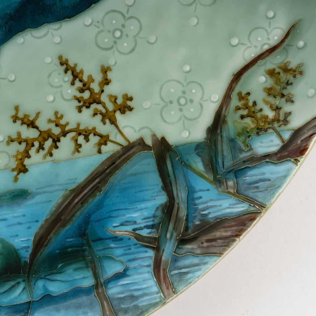 Glazed ceramic dish with polychrome decoration representing a mallard duck Produced by the Sèvres factory, signed Emile Richard, Art Nouveau period, circa 1900. | Biron Glazed ceramic dish with polychrome decoration representing a mallard duck Produced by the Sèvres factory, signed Emile Richard, Art Nouveau period, circa 1900.