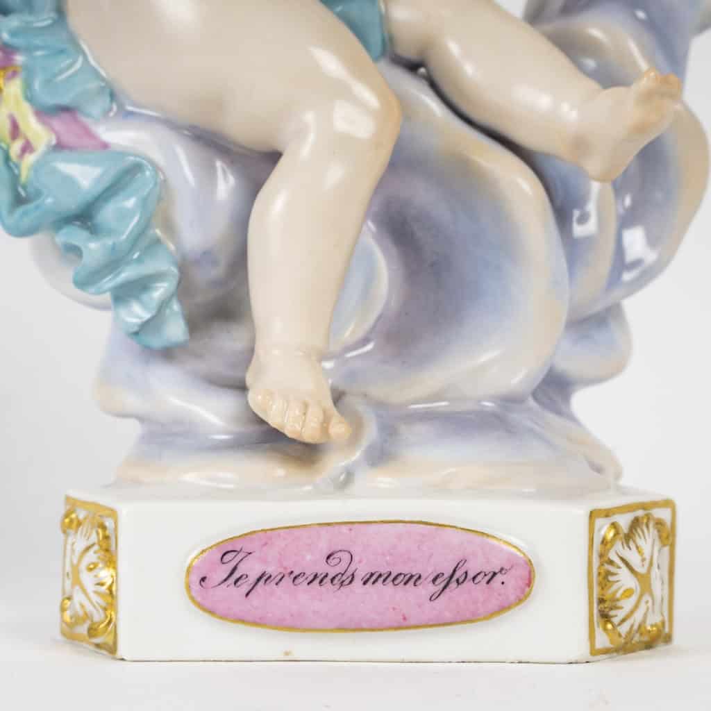 Porcelain figurine from the Meissen factory, series of angels with mottos called Devisenkinder, XIX1st century | Biron Porcelain figurine from the Meissen factory, series of angels with mottoes known as Devisenkinder, XIXth century