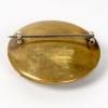 Broche « Grenouilles » verre blanc patiné vert foncé sur clinquant jaune de René LALIQUE | Biron Broche "Grenouilles" verre blanc patiné vert foncé sur clinquant jaune de René LALIQUE