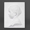 Paire de profil d’enfant en plâtre, XXème siècle. | Biron Paire de profil d’enfant en plâtre, XXème siècle.