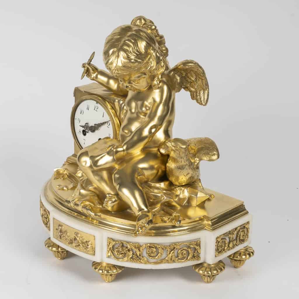 l’Amour Messager- Pendule De Style Louis XVI En Marbre Et Bronze Doré. Modèle De J.-b. Pigalle. | Biron l'Amour Messager- Pendule De Style Louis XVI En Marbre Et Bronze Doré. Modèle De J.-b. Pigalle.