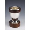 Gustave KELLER – Vase en argent massif époque ART DECO | Biron Gustave KELLER - Vase en argent massif époque ART DECO VASE en argent massif de forme ovoïde moderniste, monté sur un socle en palissandre, le piédouche et le col sont cernés par un double anneau en palissandre. Dimensions : hauteur 20,5 cm - diamètre de la base 12 cm - diamètre du col 13 cm Matière : Argent 1er titre 950/°°° Poids : 1220 grammes brut Poinçon : MINERVE Epoque : ART DECO vers 1930 Orfèvre : Gustave KELLER Origine : France / PARIS