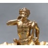 Maison BOUDET – Exceptionnelle Paire de salerons en vermeil 19e siècle | Biron Maison BOUDET - Exceptionnelle Paire de salerons en vermeil XIXe Exceptionnelle paire de salerons en vermeil représentée par un triton soufflant dans une conque, au milieu de deux grands coquillages posés sur une base ovale à contours feuillagés. Ici le thème marin s'inspire du bassin "Neptune" de Versailles et d'un centre de table exécuté par Emile Froment Meurice pour le duc Medina Celi, aujourd'hui conservé au Palais royal de Madrid. On peut attribuer ce travail à la maison Boudet, 43 boulevard des Capucines à Paris. Exemple cette Importante paire de rafraichissoirs et leurs présentoirs adhérents en argent et vermeil. Epoque fin du XIXe siècle exécutée par la maison BOUDET. (photo jointe) Dimensions : longueur 24 cm - largeur 13,4 cm - hauteur 16,5 cm Matière : Argent vermeil 1er titre 950/°°° Poids : 2.900 grammes Poinçons : MINERVE et SANGLIER Epoque : XIXè siècle Orfèvre : Attribué à Victor BOUDE losange avec trace d'initial d'orfèvre Origine : France/Paris Victor Boudet est un orfèvre ciseleur qui a insculpé son poinçon en 1894. Son atelier situé 43 Boulevard des Capucines est encore en activité en 1902 avant son déménagement. Ces magnifiques salerons ne semblent pas présenter de poinçon d'orfèvre. Il est donc vraisemblable que Boudet ait ciselé cette pièce avec une grande virtuosité mais il est impossible d'assurer qu'il en soit l'orfèvre.