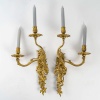 Paire d’appliques à deux bras de lumières asymétriques d’époque Louis XV en bronze ciselé et doré vers 1750 | Biron 