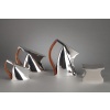 Rare et exceptionnel Pierre CARDIN - Service thé café 4 pièces argent massif modèle futuriste XXè service à thé café 4 pièces en argent massif de type futuriste composé d'une théière, d'une cafetière, d'un pot à lait, d'un sucrier couvert, les anses sont en bois teinté palissandre, chaque pièce est marquée G.SILVA sous la base. TRAVAIL FAIT A LA MAIN . Pierre CARDIN (1922-2020) designer/Editeur & Giuseppe SILVA orfèvre à Milan, ont conçu vers 1975 le modèle "ROBY" qui a remporté le 1er prix de la Vème édition du Premio Nazionale Sant'Eligio Arte Orafa en 1975. Dimensions : cafetière ht 23 cm - Théière ht 16 cm - sucrier ht 9 cm - pot à lait ht 12 cm Matière : argent massif Poids : 2820 grammes Poinçon : 84 MI-(Milan) Epoque : XXè 1970/1975 Orfèvre : Giuseppe SILVA Origine : ITALIE DU NORD