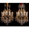 Signé par les Cristalleries de Baccarat paire de lustres de style Louis XV en bronze doré et cristal taillé vers 1880-1890 | Biron 
