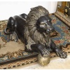 Paire de lions en bronze patine 