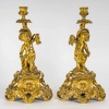 Paire de bougeoirs d’époque Napoléon III à décor de Putti en bronze doré, montée en lampes | Biron 