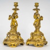Paire de bougeoirs d’époque Napoléon III à décor de Putti en bronze doré, montée en lampes | Biron 