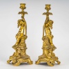 Paire de bougeoirs d’époque Napoléon III à décor de Putti en bronze doré, montée en lampes | Biron 