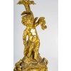 Paire de bougeoirs d’époque Napoléon III à décor de Putti en bronze doré, montée en lampes | Biron 