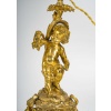 Paire de bougeoirs d’époque Napoléon III à décor de Putti en bronze doré, montée en lampes | Biron 