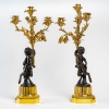 Paire de candélabres de style Louis XVI en bronze à décor de Faunes, montés en lampes | Biron 