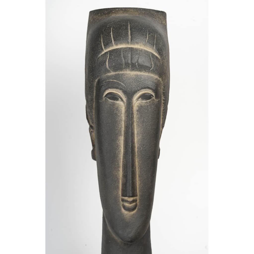 Paire de sculptures en terre cuite dans le goût de Modigliani, XXème siècle. | Biron 