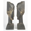 Paire de sculptures en terre cuite dans le goût de Modigliani, XXème siècle. | Biron 