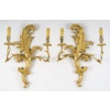 Suite de 4 appliques de style rocaille en bois sculpté et doré, circa 1900 | Biron 